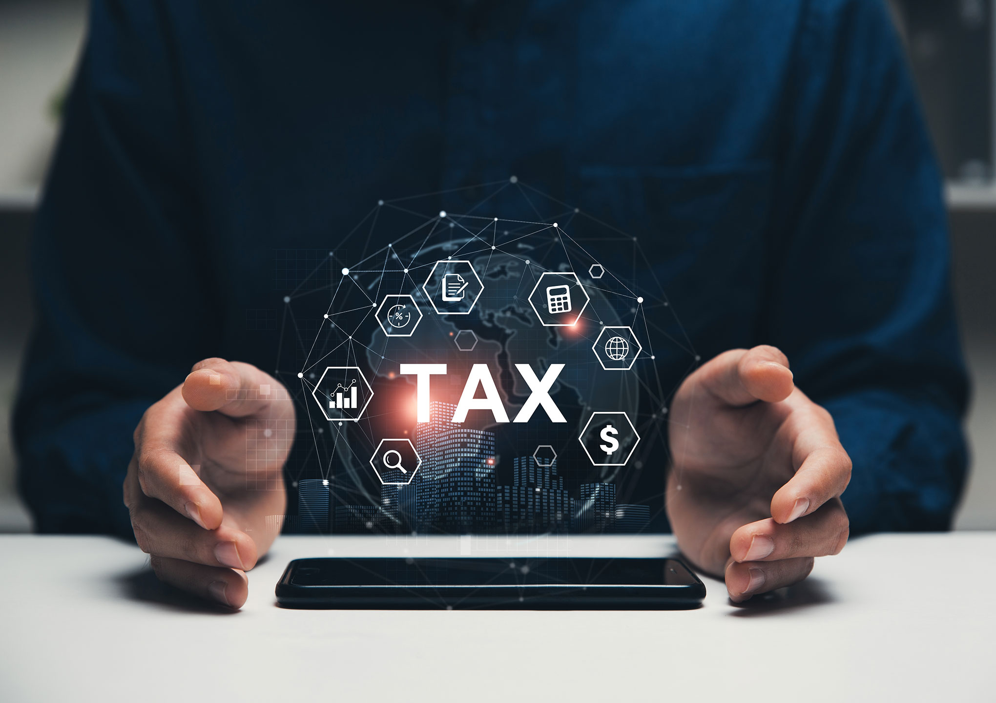 Tax icons concept, Hand of businessman in the table with smartphone to tax return online for tax payment.